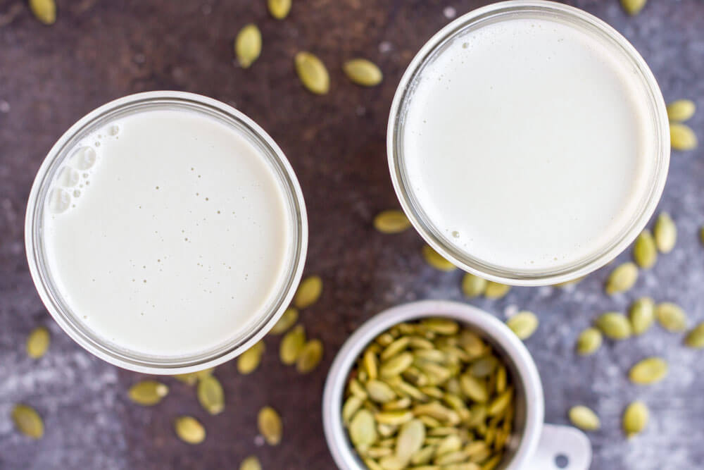 two glasses of white liquid