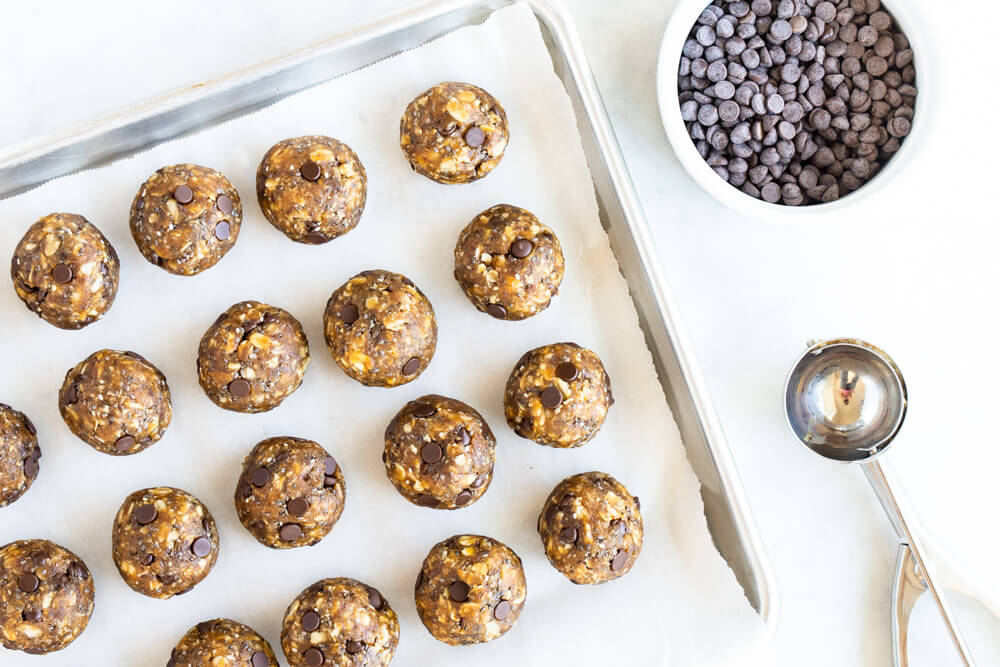 baking tray with peanut butter pumpkin balls on it