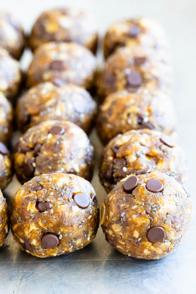 close up of peanut butter pumpkin balls in a row