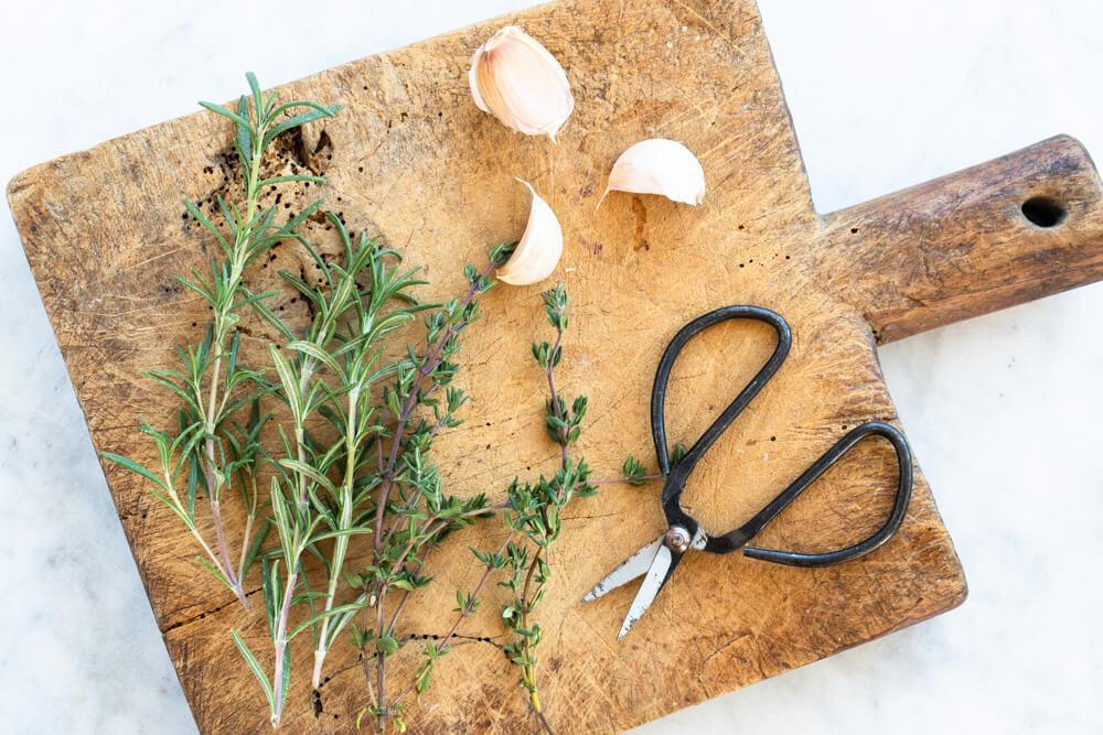 cutting board with fresh herbs