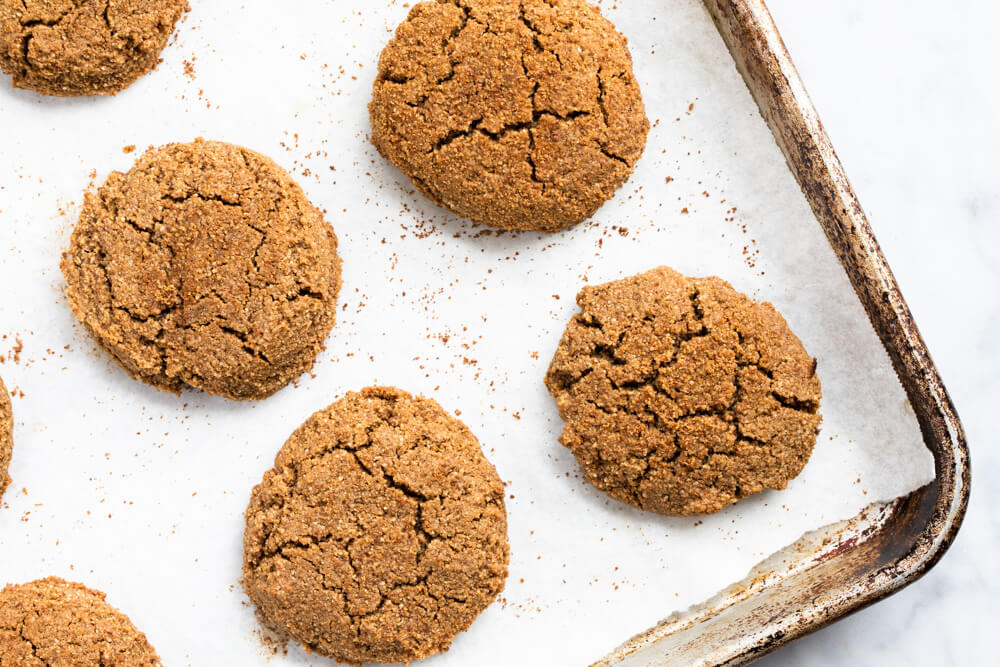 big gingerbread cookies on baking sheet