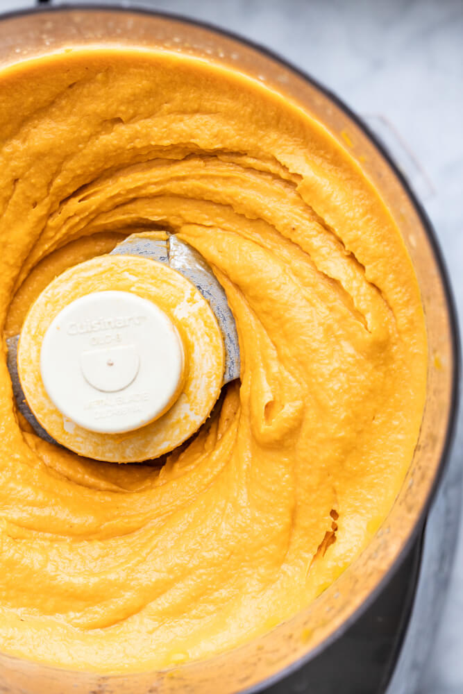 close up of sweet potato hummus in food processor