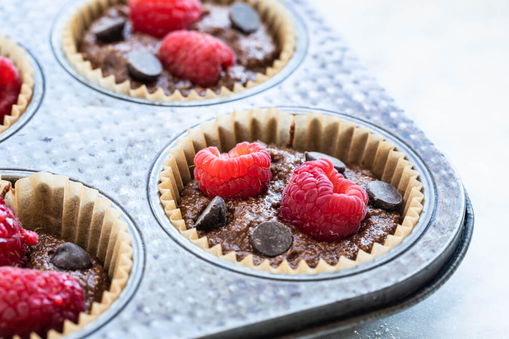 raspberry in a vegan chocolate muffin