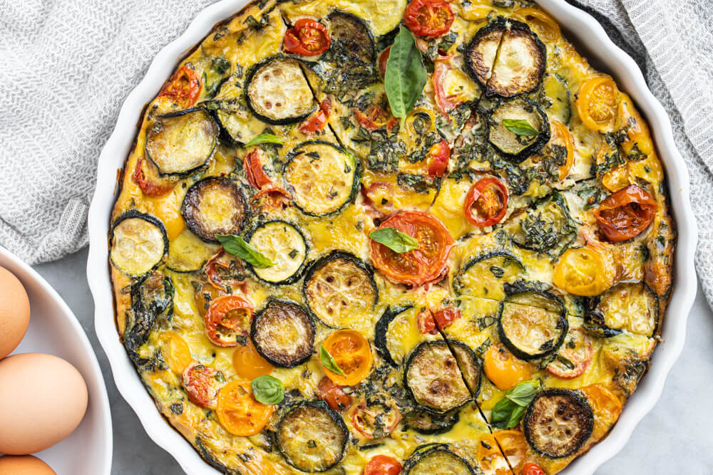 close up of sliced quiche