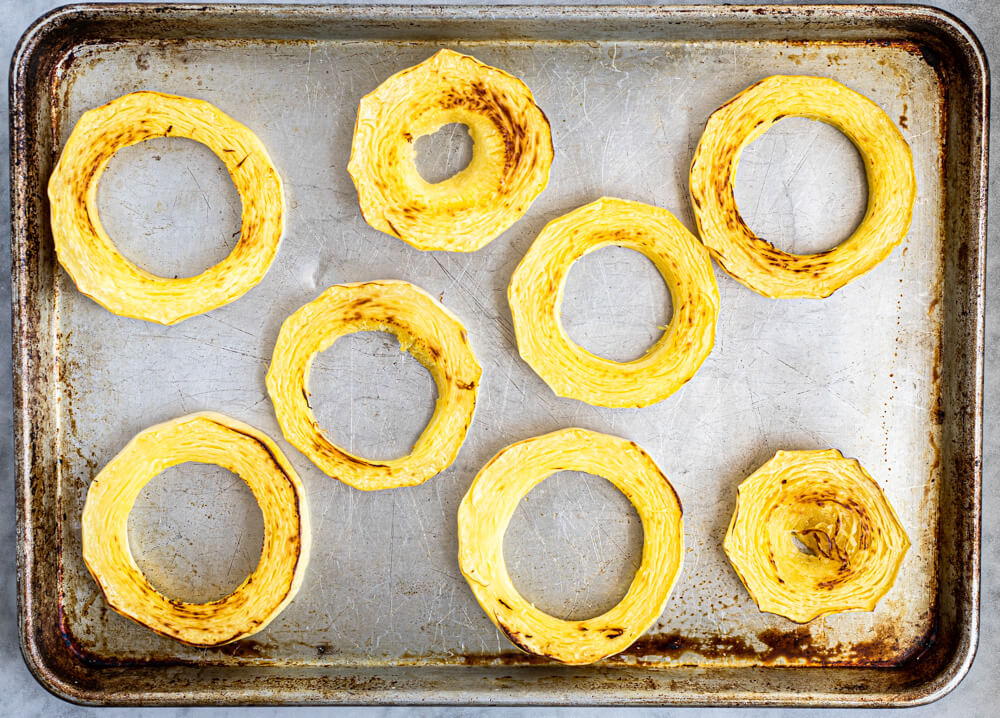 8 rings of spaghetti squash on baking sheet