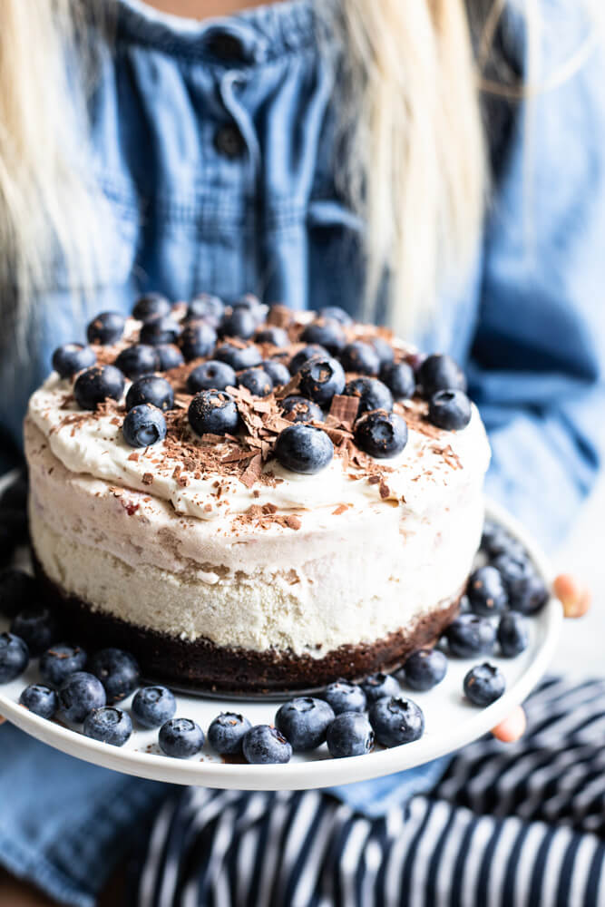 hands holding ice cream cake