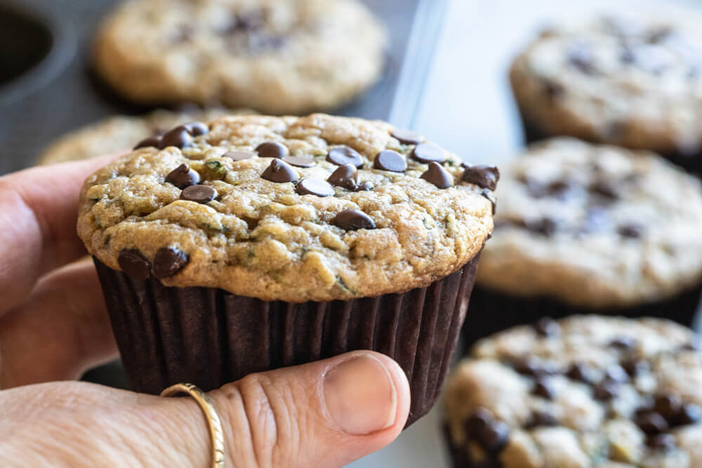 hand holding zucchini muffin