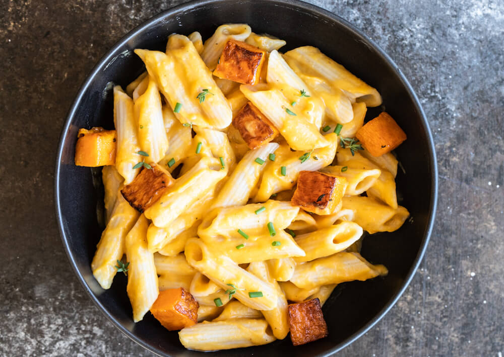 butternut squash pasta in black bowl