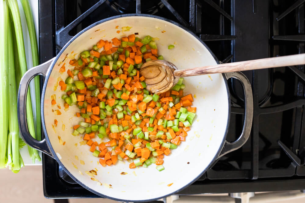 carrots and celery cooking in pot