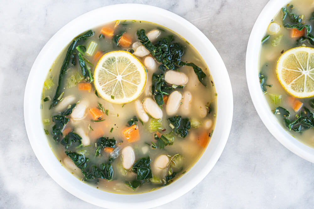 two white bowls of soup