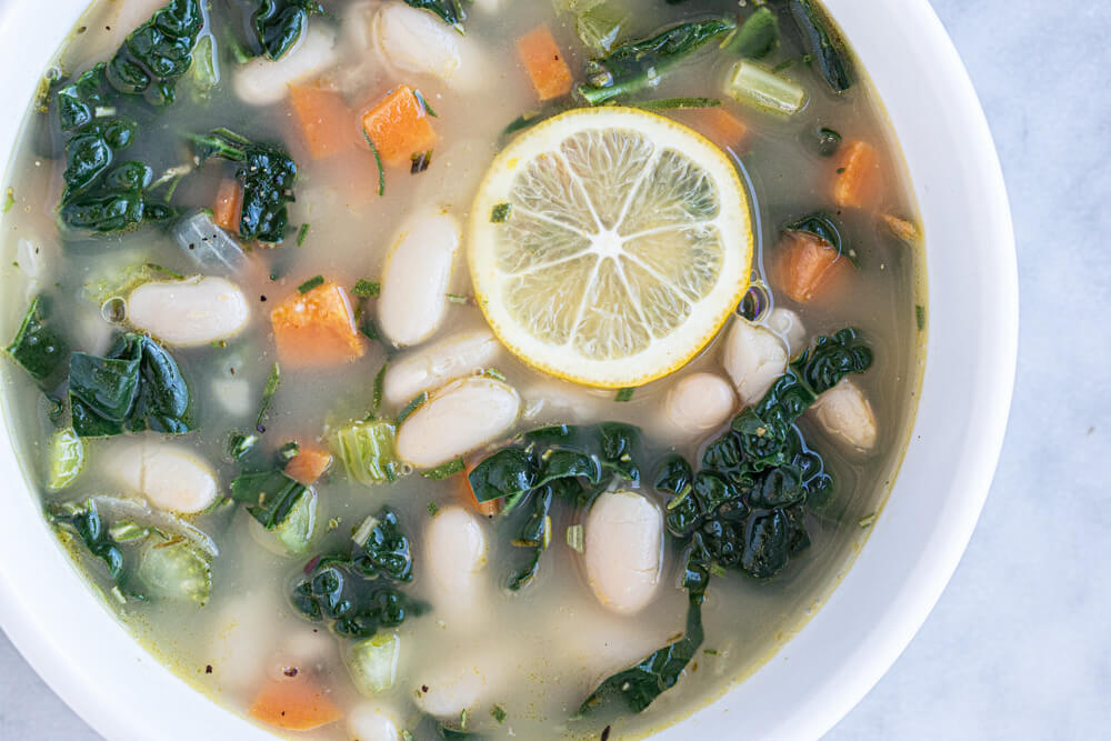 close up of a bowl of white bean soup