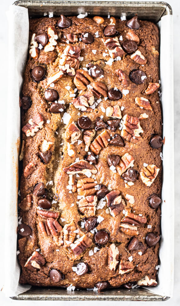 baked banana bread in silver loaf pan