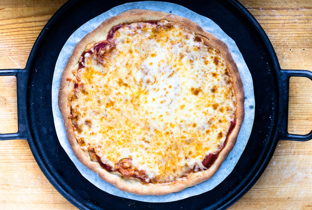 whole gluten free pizza on cast iron pan