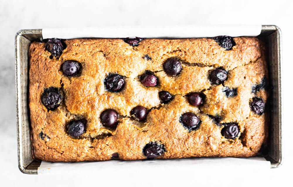 loaf of banana bread with blueberries on top