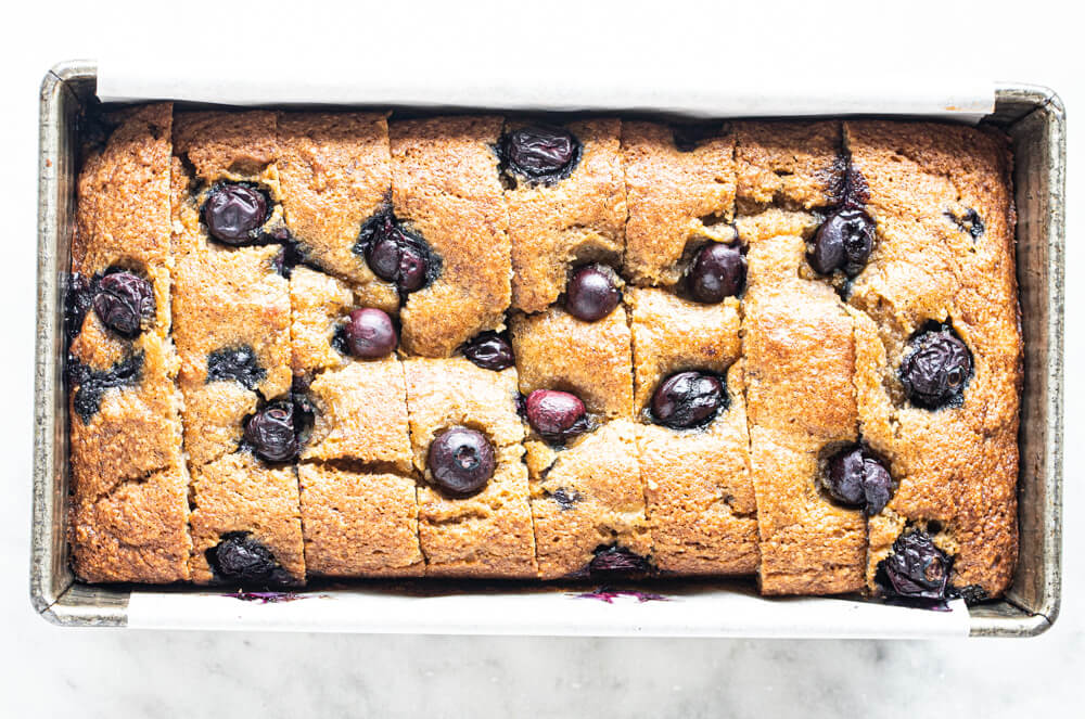 blueberry banana bread loaf in metal pan