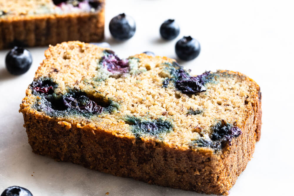 slice of banana bread on white counter
