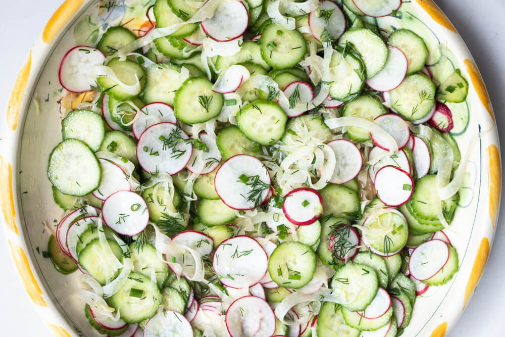 cucumber salad in yellow bowl