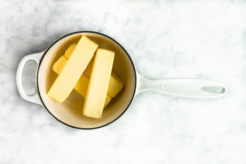 white pot with butter in it