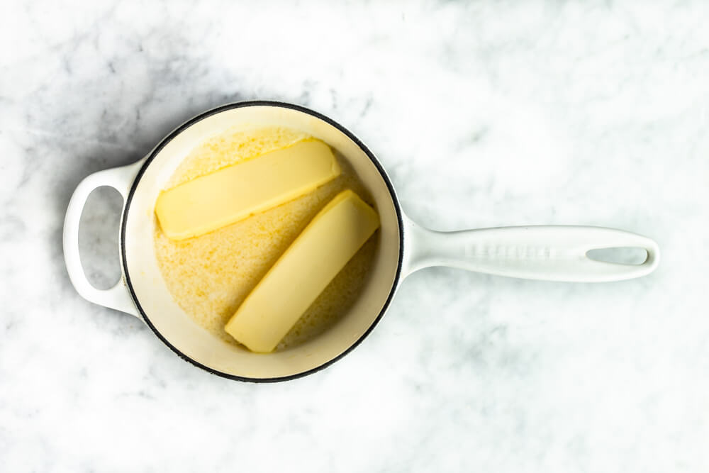white pot with melting butter in it