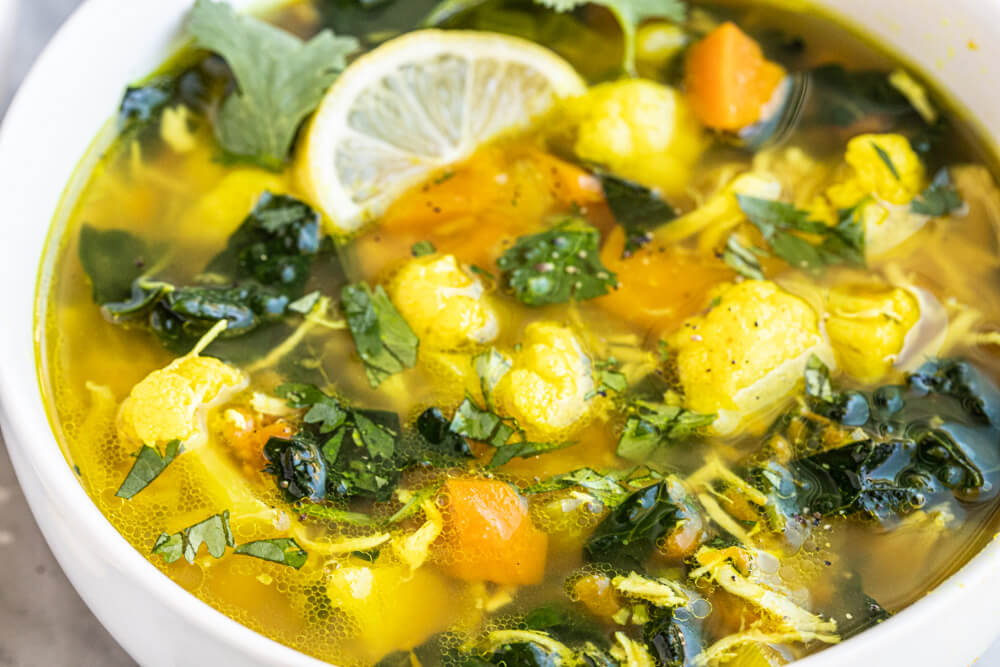 close up of turmeric ginger chicken soup