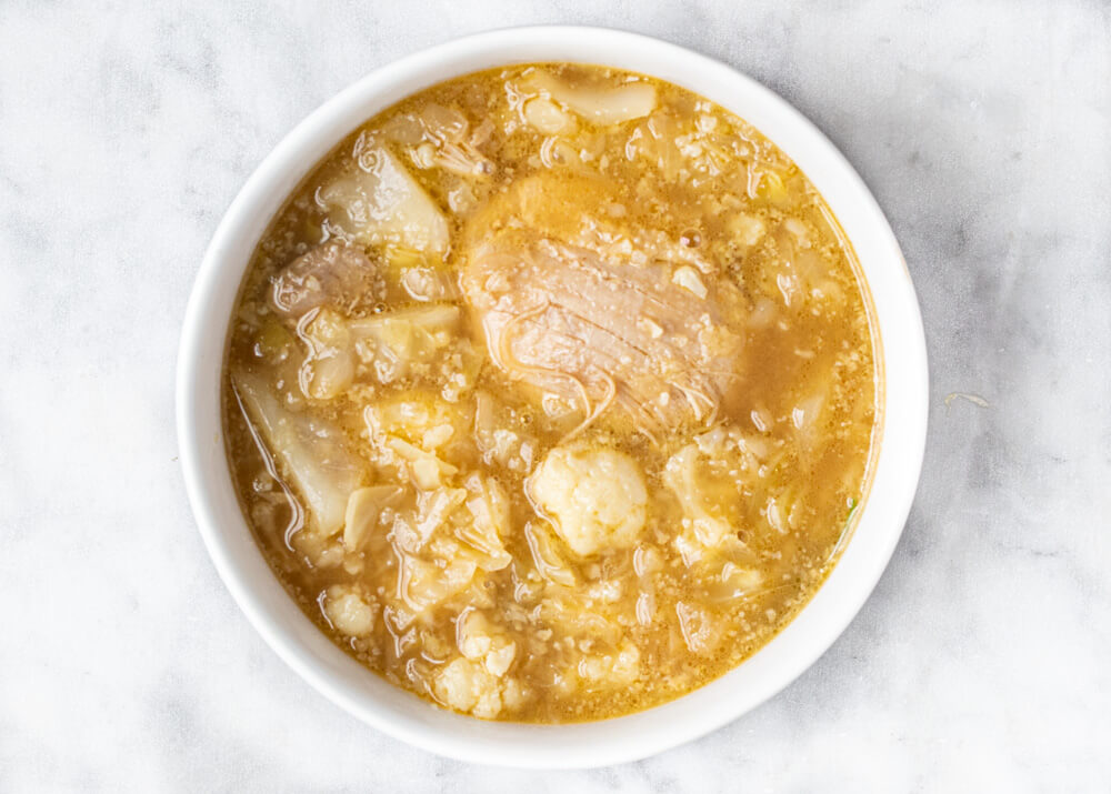 white bowl full of soup