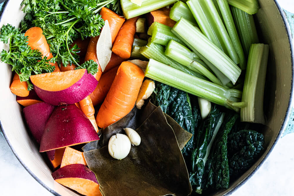 raw vegetables in blue pot