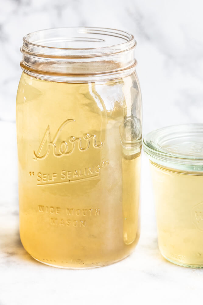 mason jar with yellow mineral broth
