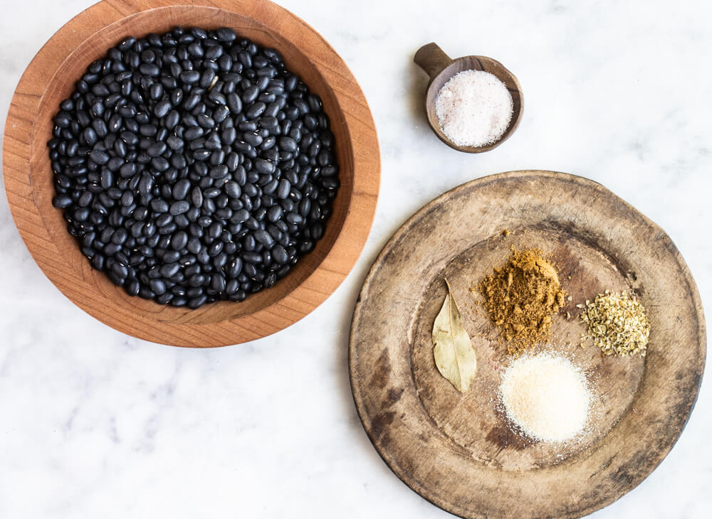 wooden bowl full of black beans