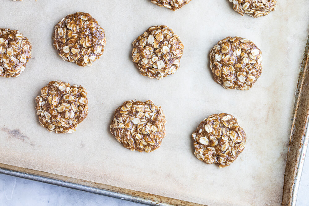 unbaked cookies on metal tray