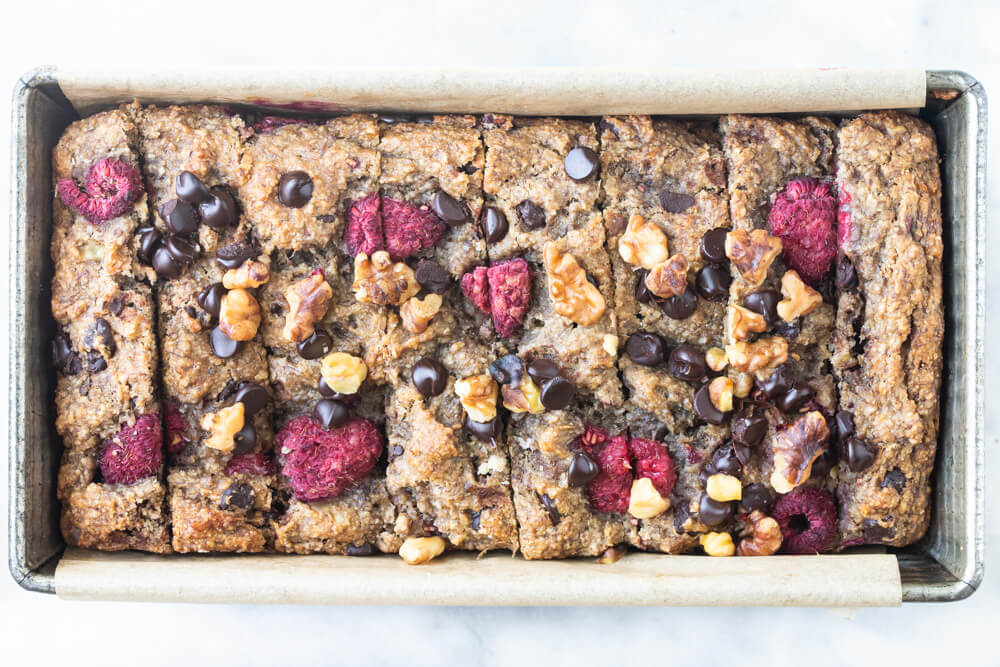 raspberry chocolate chip banana bread loaf sliced up