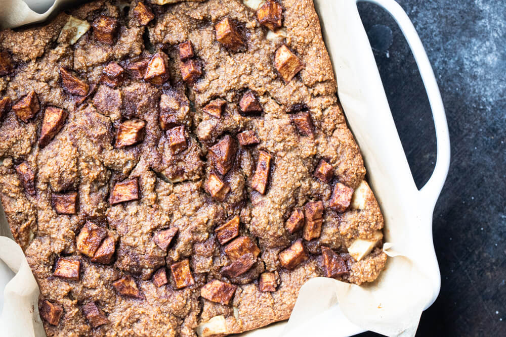 close up of white dish with apple bars