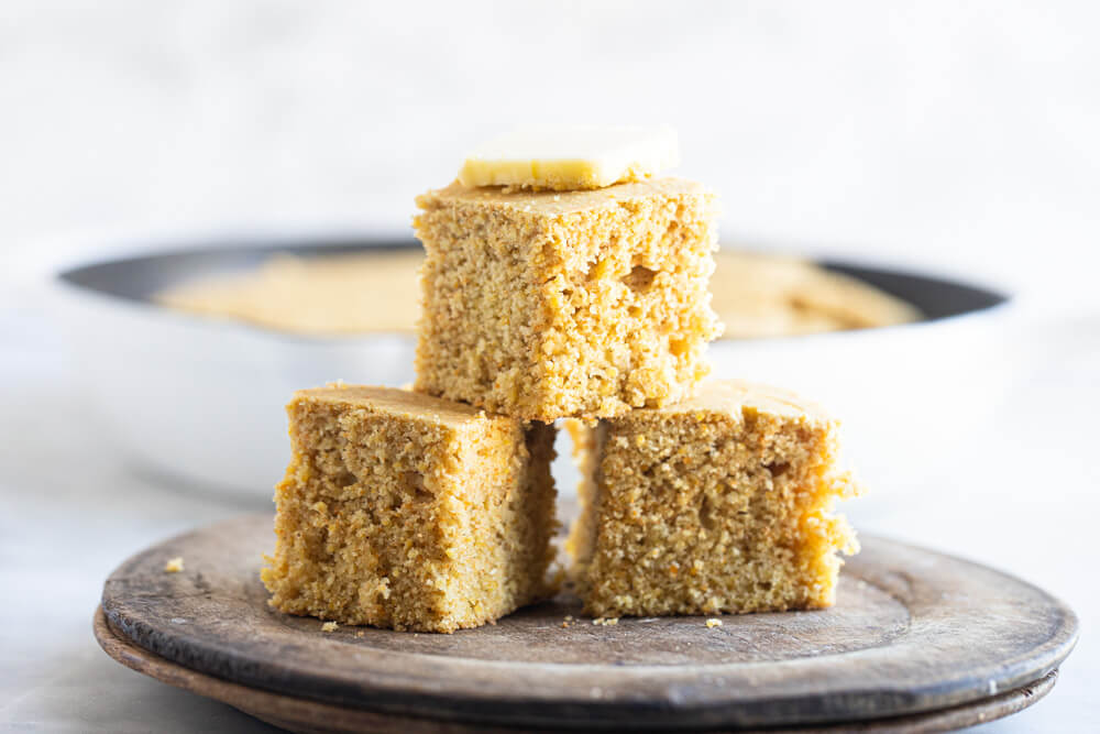 three pieces of gluten free cornbread on a plate