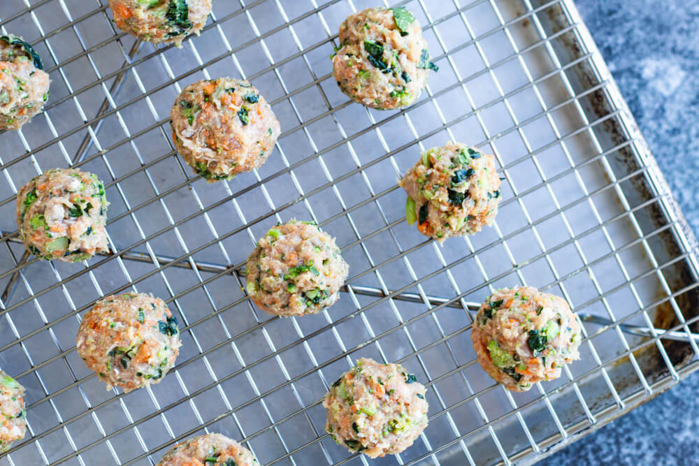 raw meatballs on baking tray